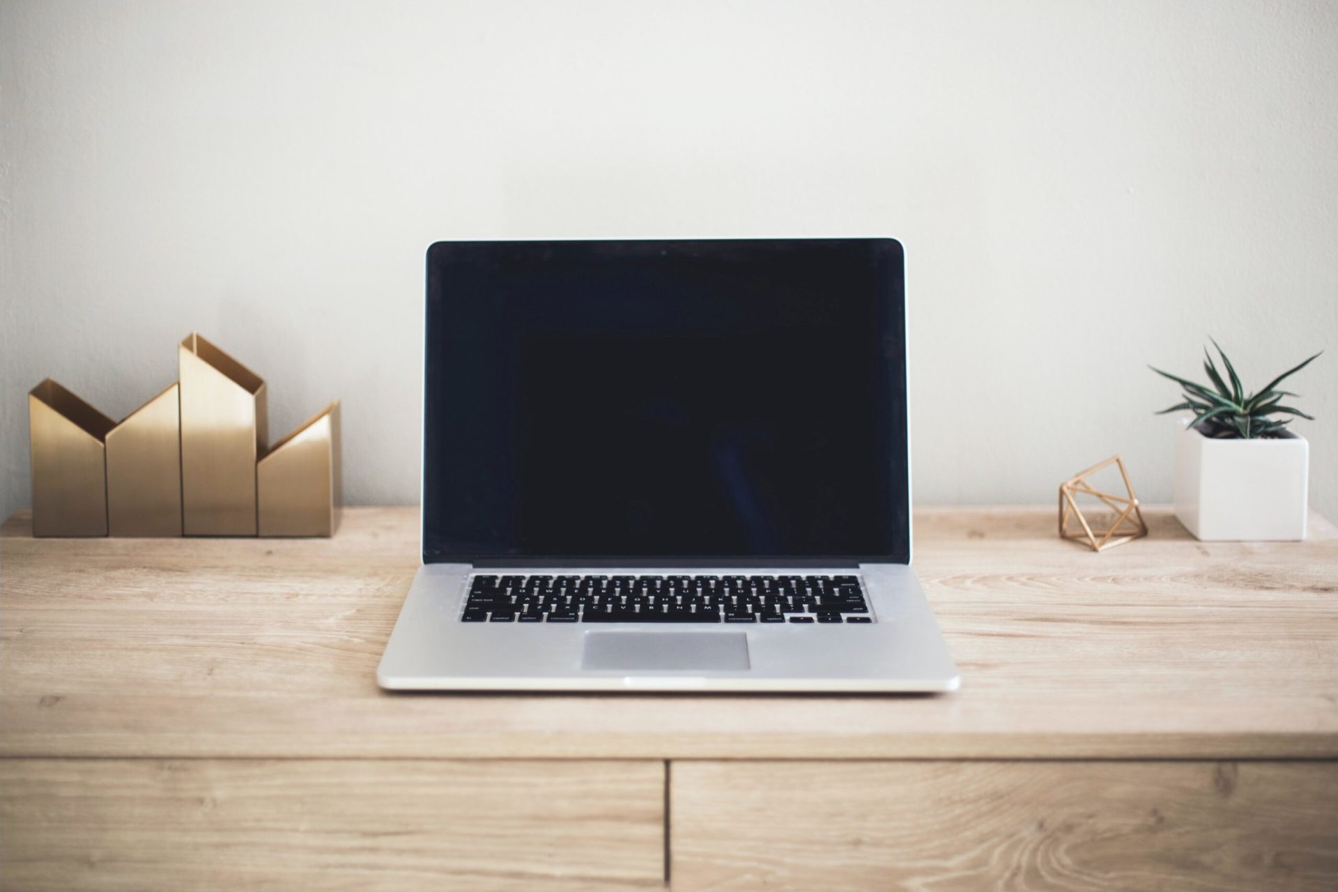 wooden desk with computer
